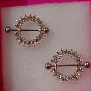 Mystic Metal Rose Gold And Cubic Zirconiun  Sheilds. Size 12Gg